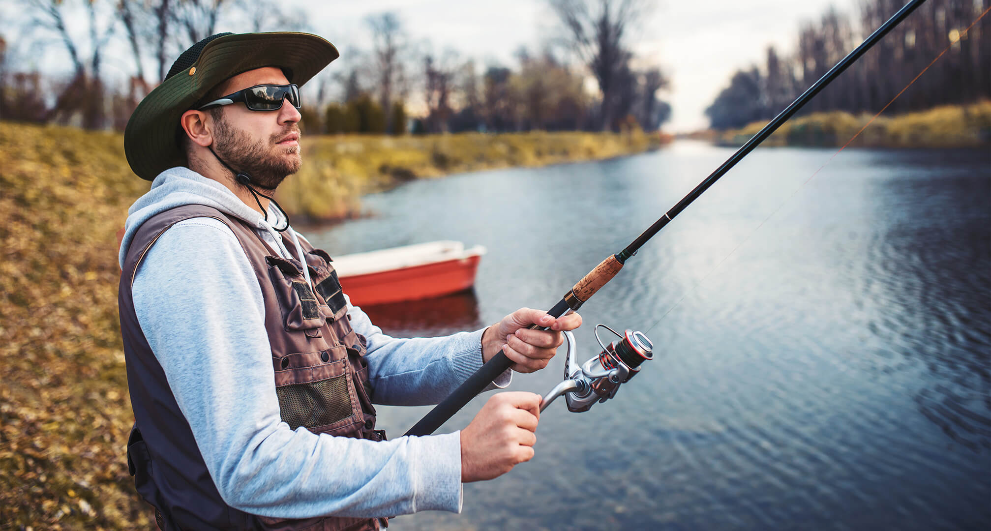 person fishing and wearing sunglasses